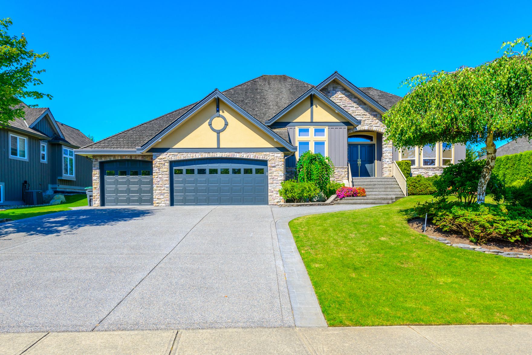 Detached family home with a driveway and attached garage